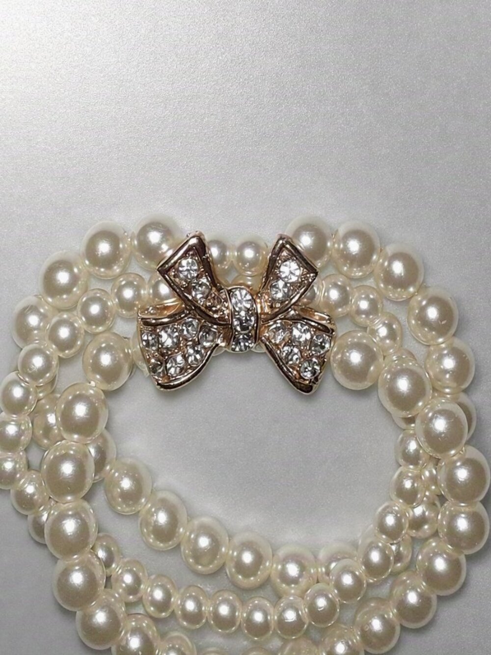 Three-Strand Pearl Bracelet with Crystal Bow Center